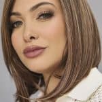 Woman with shoulder-length brown hair styled straight and sleek.